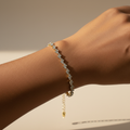 Gold Bracelet on Brown Wrist